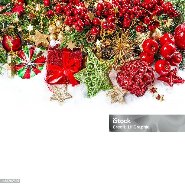 Baubles Golden Garlands Christmas Tree And Red Berries Stock Photo - Download Image Now