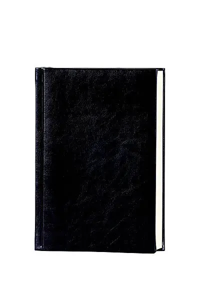 Book in the dark cover on a white background