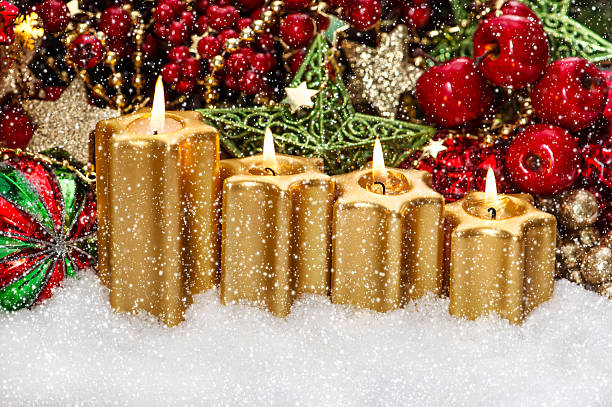 istock advent decoration with four burning golden candles 488265583