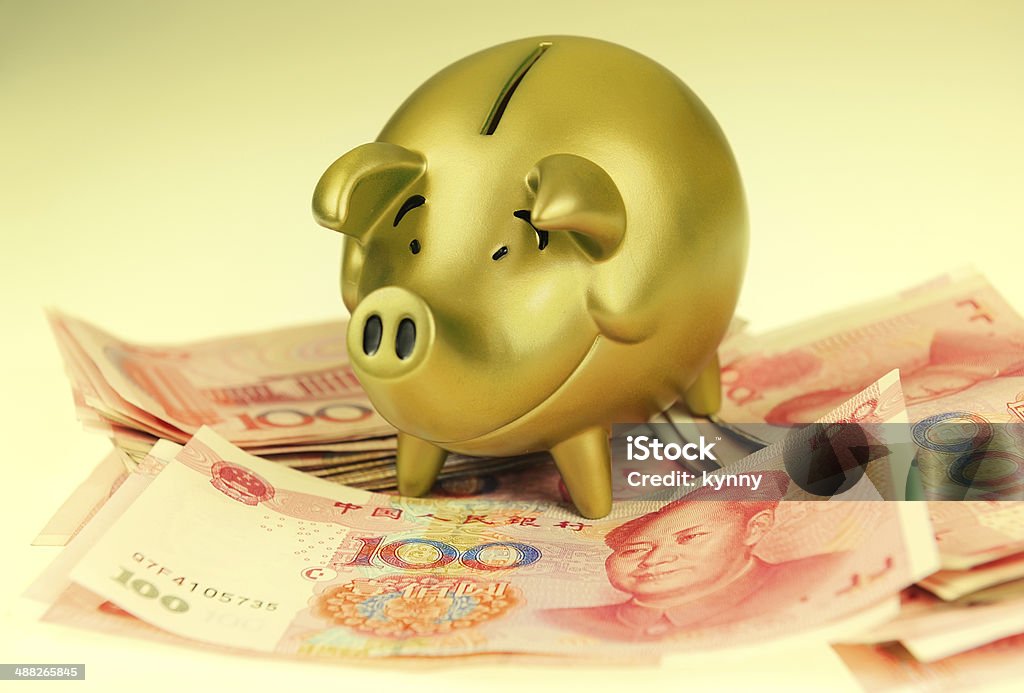piggy bank and one-hundred rmb bill Bank Deposit Slip Stock Photo