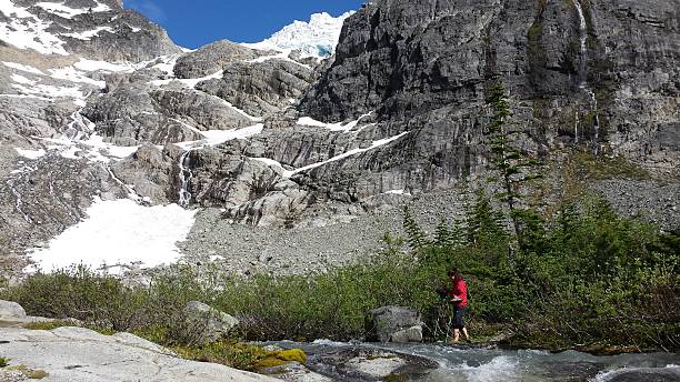 istock Woman about to cross a water stream 488268786