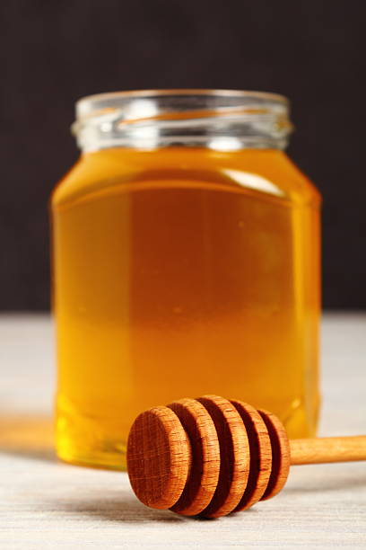 istock Jar of Honey with Honey Dipper 488269932