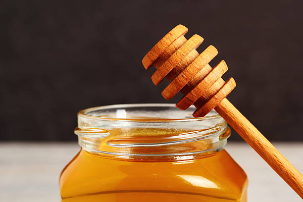 istock Jar of Honey with Honey Dipper 488269966
