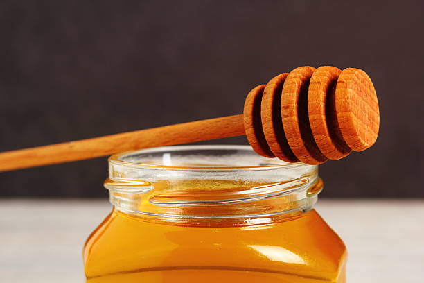 istock Jar of Honey with Honey Dipper 488269986