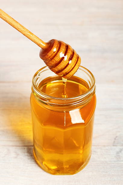 istock Jar of Honey with Honey Dipper 488269996