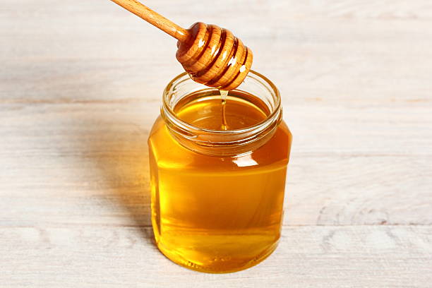 istock Jar of Honey with Honey Dipper 488270032