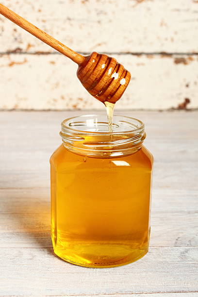 istock Jar of Honey with Honey Dipper 488270048
