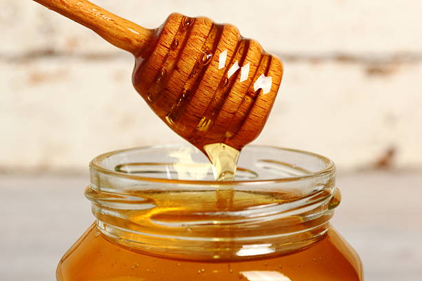 istock Jar of Honey with Honey Dipper 488270090
