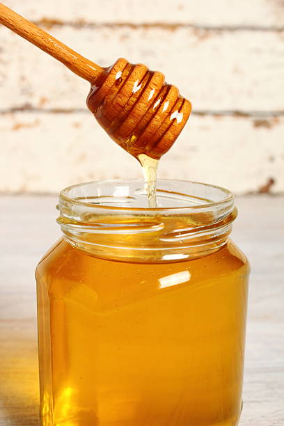 istock Jar of Honey with Honey Dipper 488270108