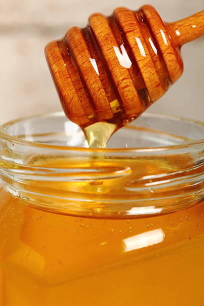 istock Jar of Honey with Honey Dipper 488270116