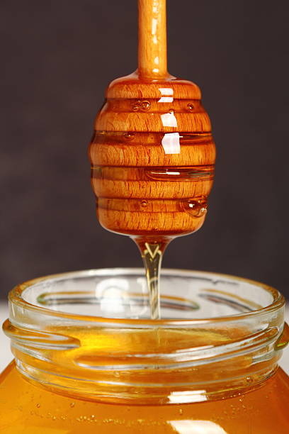 istock Jar of Honey with Honey Dipper 488270220