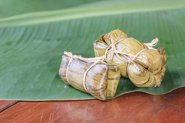 istock rice steamed in green banana leaf 488270574