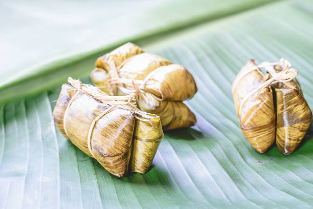 istock rice steamed in green banana leaf 488270776