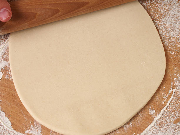istock Roll out dough to square. Making Puff Pastry Series. 488271056