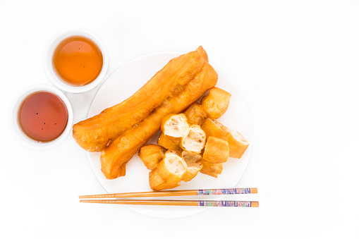 Fried bread stick or You Tiao served with Chinese tea