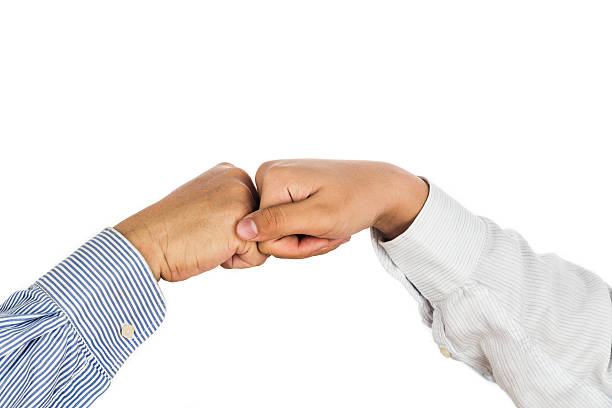 istock Fist bump on formal wear, gesturing an agreement and cooperation 488273060