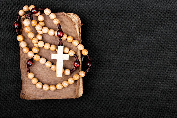 istock rosary and prayer book on a dark background 488273360