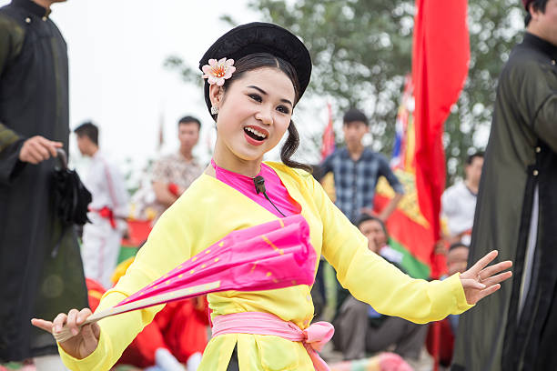 Namdinh, Vietnam - April 6, 2014:  The unidentified woman is dancing in a traditional folk festival in Phu Giay, Nam Dinh, Vietnam.