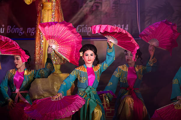 Namdinh, Vietnam - April 6, 2014:  The unidentified woman is dancing in a traditional folk festival in Phu Giay, Nam Dinh, Vietnam.