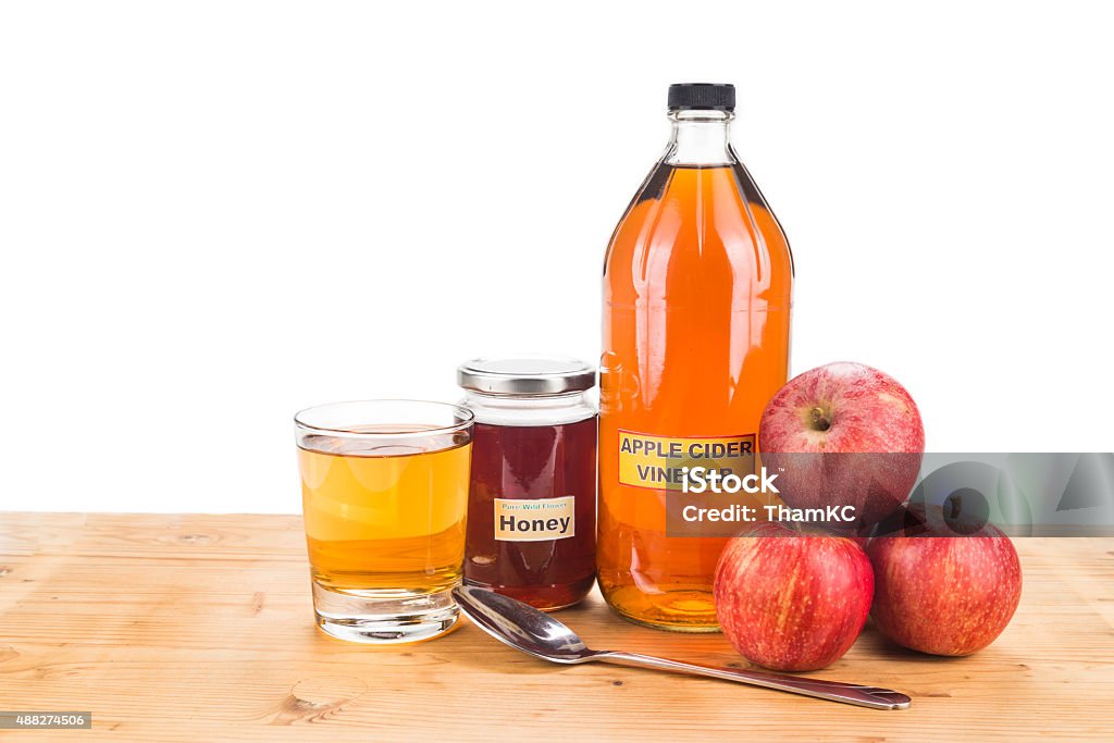 Apple cider vinegar with honey, natural remedies and cures Apple cider vinegar with honey, natural remedies and cures for common health condition 2015 Stock Photo