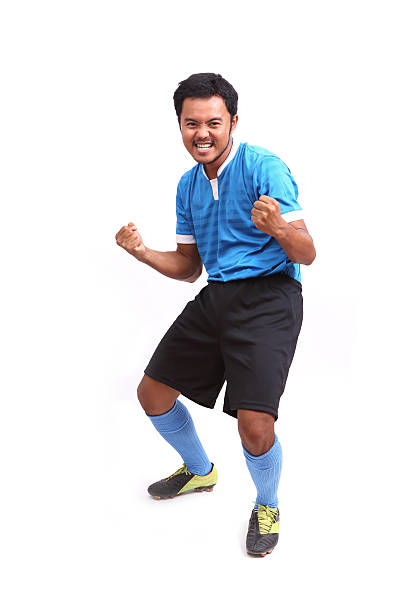 istock Young soccer football player on white 488275801