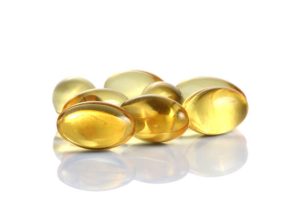 olio di fegato di merluzzo di omega 3 capsule di gelatina - gel capsules foto e immagini stock