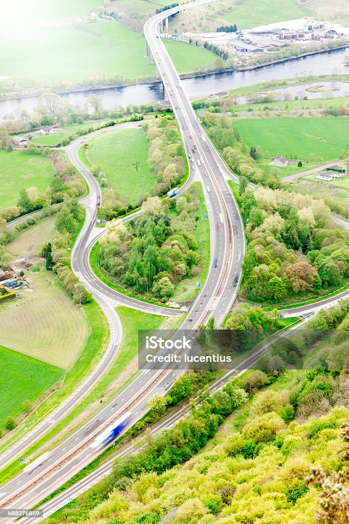 Highway with intersection in green rural setting Multiple lane highway with intersection in green rural setting outside Perth, Scotland. AdobeRGB colorspace. Perth - Scotland Stock Photo