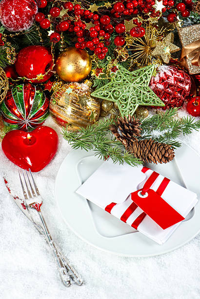 istock christmas table place setting with red heart candle 488277333