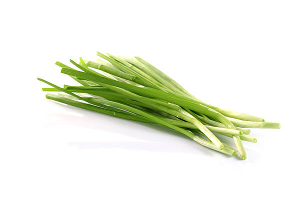 istock Bundle of garlic chives isolated on white background 488278770
