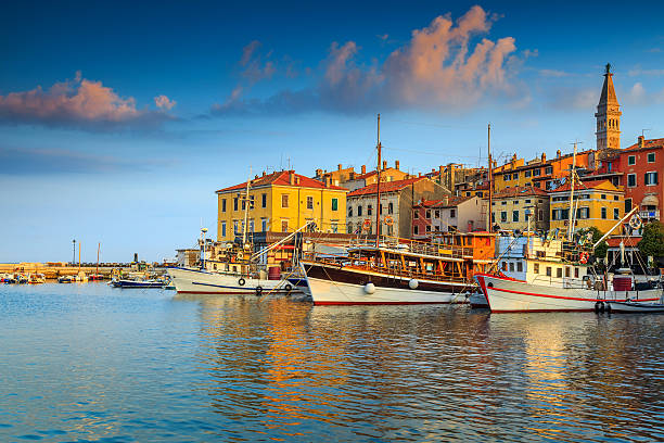 Stunning sunset with Rovinj harbor,Istria region,Croatia,Europe Beautiful romantic old town of Rovinj and famous fishing harbor with magical sunset,Istrian Peninsula,Croatia,Europe istria photos stock pictures, royalty-free photos & images
