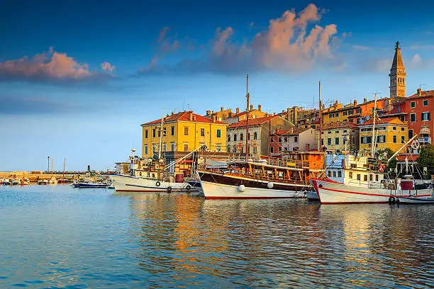 Beautiful romantic old town of Rovinj and famous fishing harbor with magical sunset,Istrian Peninsula,Croatia,Europe