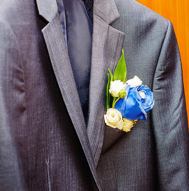 istock stylish  suit groom boutonniere 488280174