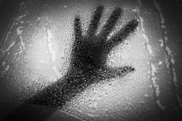 istock blurry abstract shasow of hand in water drop 488281480