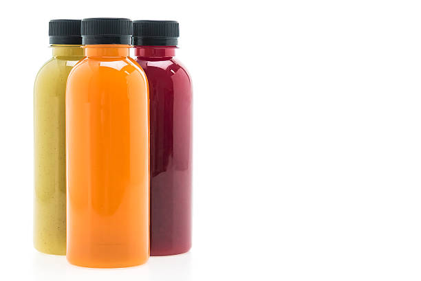 istock Fruit and vegetable juice bottles isolated on white background 488282008