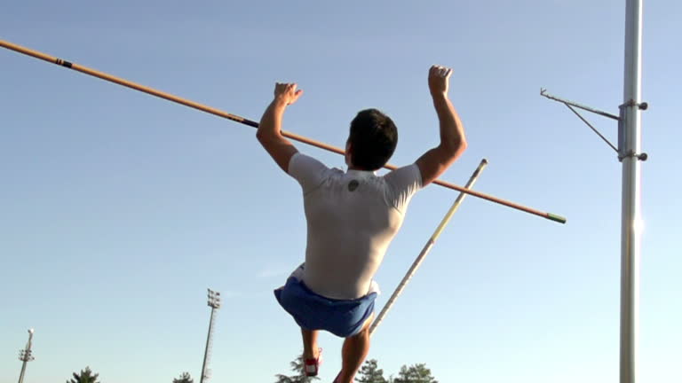 HD:Super Slo-Mo Shot of Young Athlete at Pole Vault