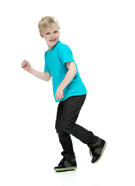 istock Side view of happy little boy walking 488301907