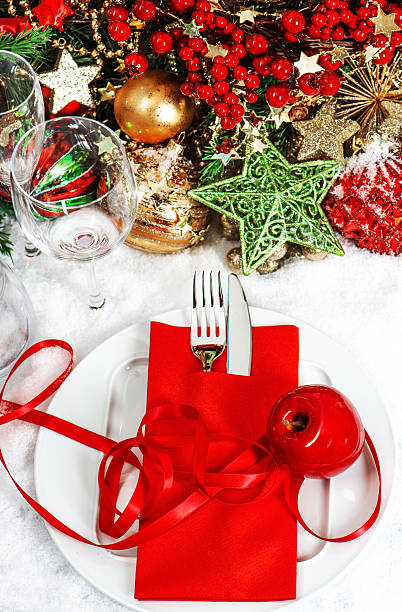 istock christmas table place setting with red and gold decorations 488302525