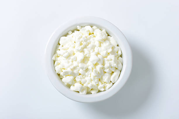 cottage cheese bowl of fresh cottage cheese isolated on white background cottage cheese photos stock pictures, royalty-free photos & images