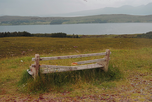 A bench next to a Scottish lake