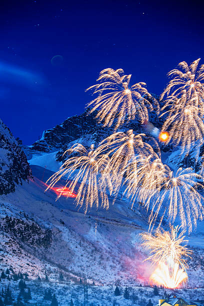 istock Brightly colorful fireworks   Night high mountain winter landscape 488305566