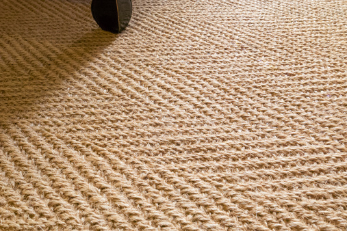 Sisal carpet in a herringbone pattern.