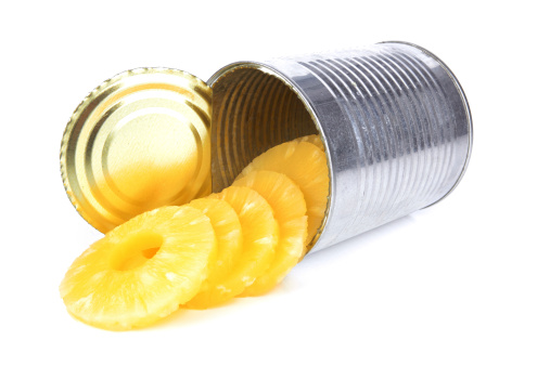 Portion of canned sliced pineapple isolated on white background