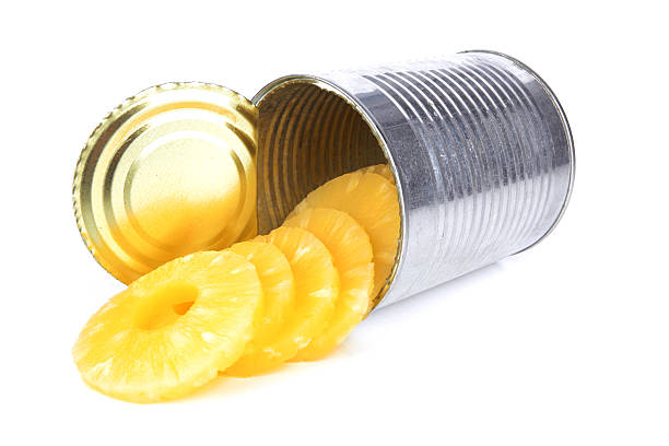 pineapple Portion of canned sliced pineapple isolated on white background canned food stock pictures, royalty-free photos & images