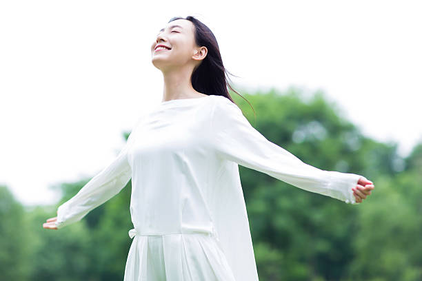 istock happy woman enjoying the sun 488306752