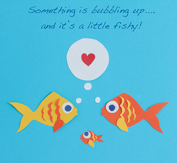 Paper fish family with words