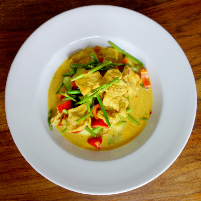 Wonderful shot of a delicious thai curry with tofu and vegetables