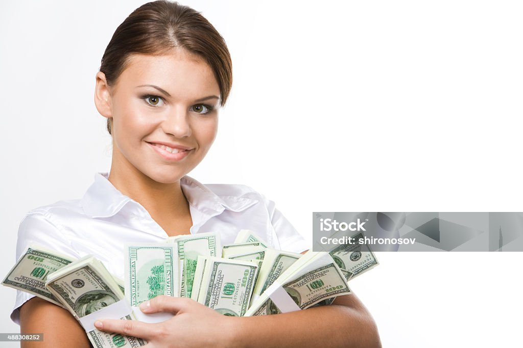 Happy girl Smiling business woman holding lots of dollars in hands   Note to inspector: the image is pre-Sept 1 2009 2015 Stock Photo