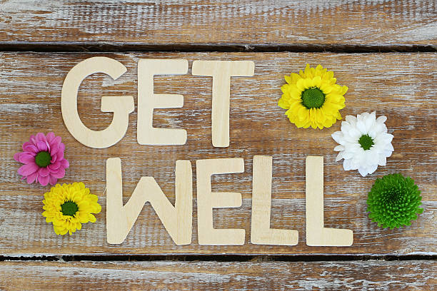 istock Get well written with wooden letters on rustic wood 488308398