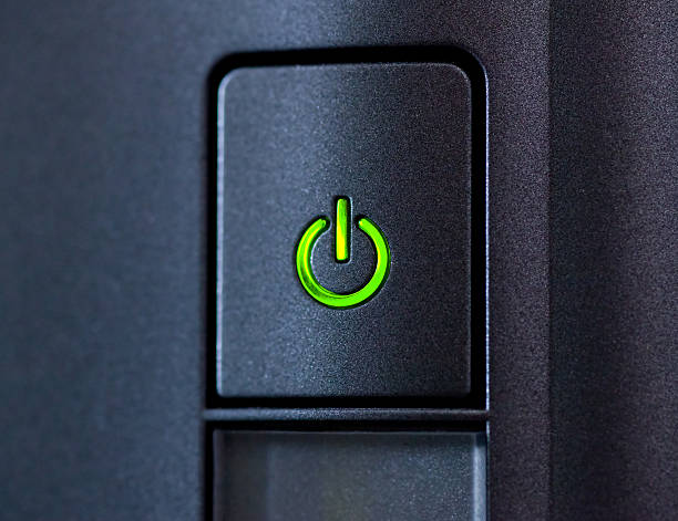 istock Green glowing power button. Closeup shot 488309008