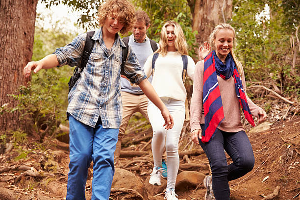 istock Family hiking through a forest, close up 488309228